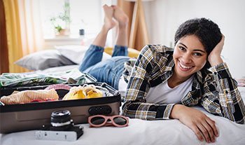 Female student packing for trip