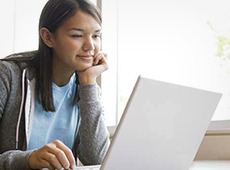 Young woman browsing on laptop